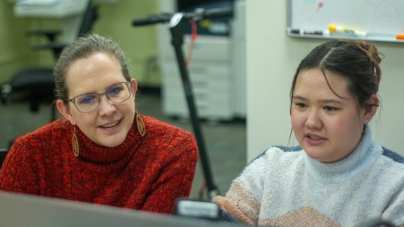 Julie helping a student